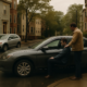 Boston car accident emotional distress claim represented by a calm recovery scene near a city street