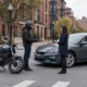 Boston motorcycle accident claim scene with a rider and motorcycle at an urban intersection