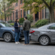 Boston car accident passenger injury claim scene with a passenger beside two stopped cars