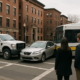 Boston government vehicle accident lawyer scene with city truck and transit bus